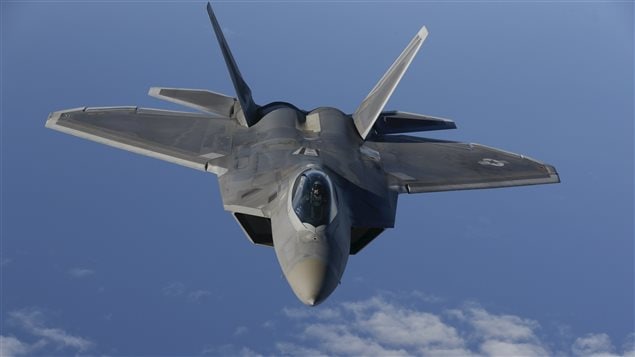 A F-22 Raptor fighter jet of the 95th Fighter Squadron from Tyndall, Florida approaches a KC-135 Stratotanker from the 100th Air Refueling Wing at the Royal Air Force Base in Mildenhall in Britain as they fly over the Baltic Sea towards the newly established NATO airbase of Aemari, Estonia September 4, 2015.