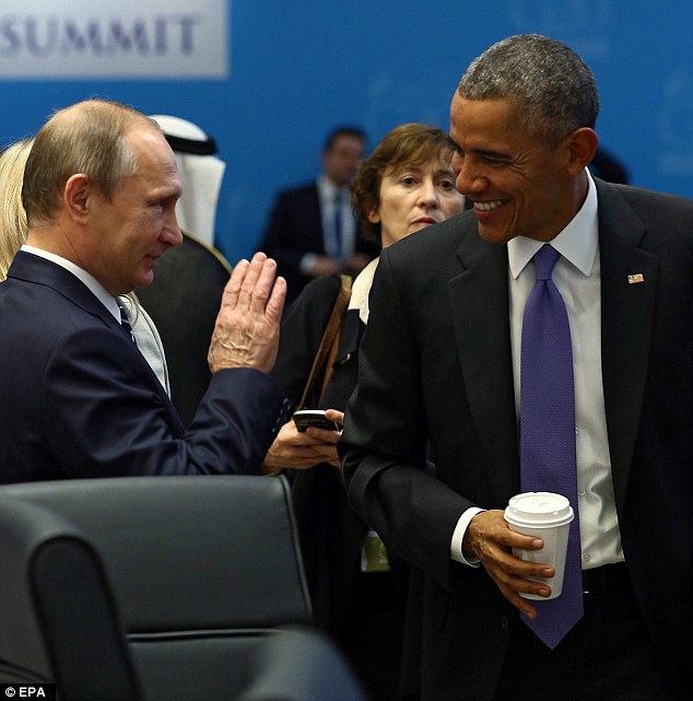 US President Barack Obama appears to share a joke with Mr Putin in a sign of relations with Moscow thawing