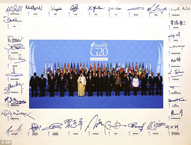 World leaders each signed their names around the frame of a family photograph taken to mark the end of the two-day conference