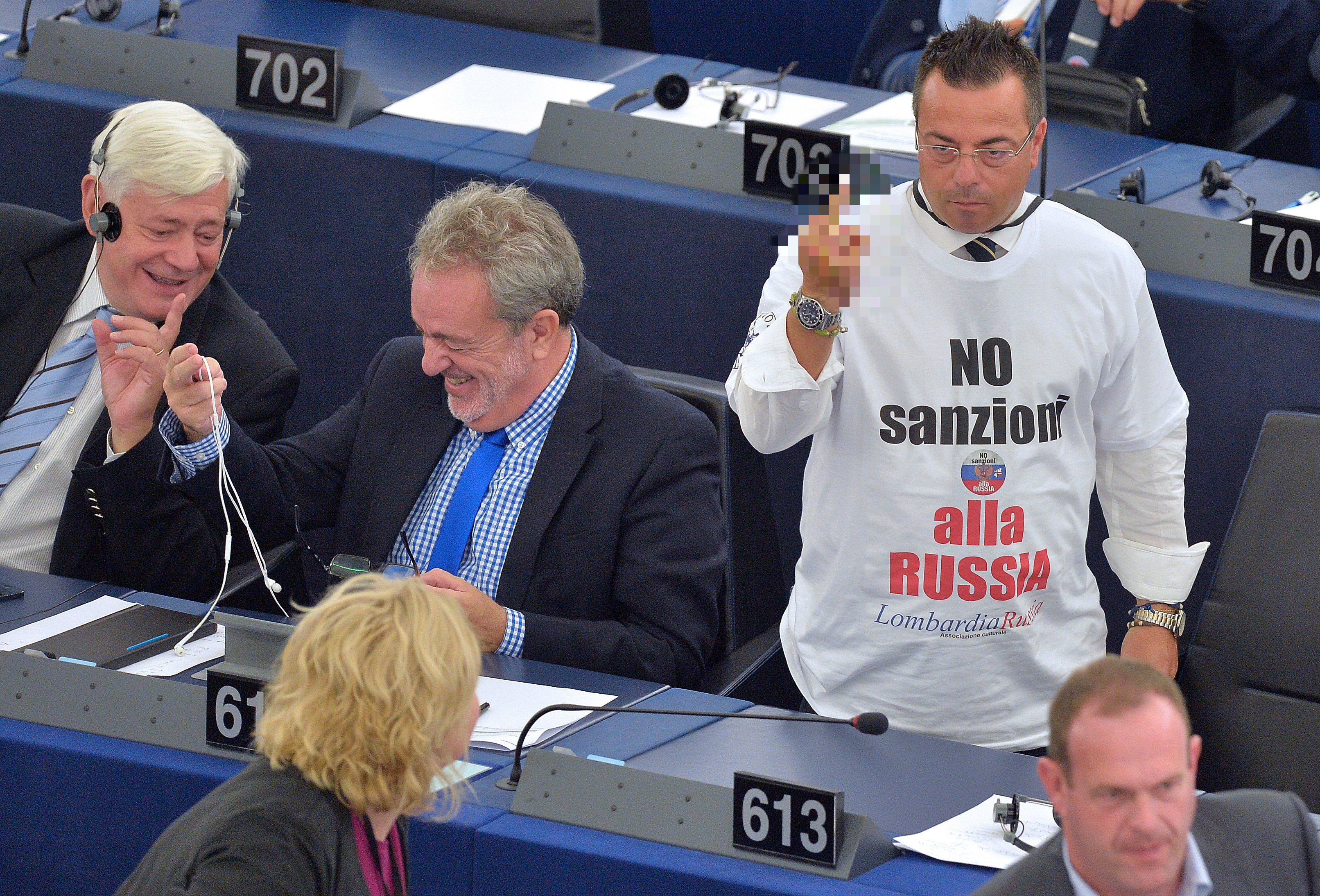Italian non-affiliated MP Gianluca Buonanno (R), wearing a shirt reading No sanctions to Russia, gestures after a video-link with lawmakers in Kiev during a voting session at the European Parliament, on September 16, 2014, in Strasbourg Italian non-affiliated MP Gianluca Buonanno (R), wearing a shirt reading No sanctions to Russia, gestures after a video-link with lawmakers in Kiev during a voting session at the European Parliament, on September 16, 2014, in Strasbourg