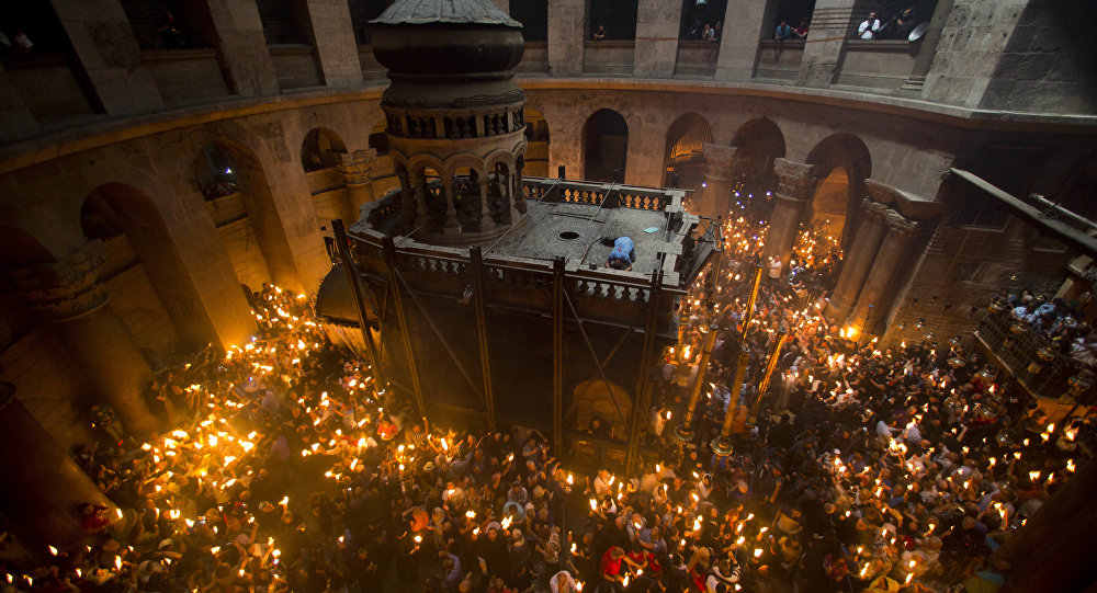 Holy Fire Descends in Jerusalem as Christians Preparing...