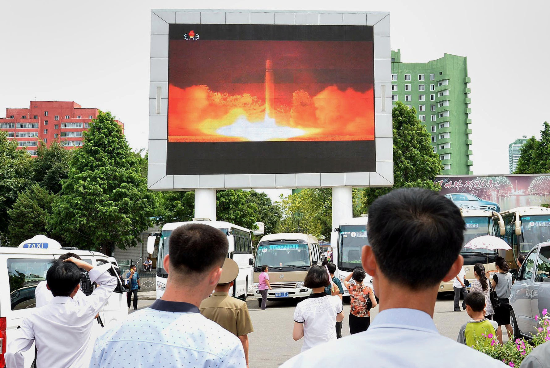 People watch news report showing North Korea's Hwasong-14 missile launch on electronic screen at Pyongyang station, North Korea in this photo taken by Kyodo on July 29, 2017 People watch news report showing North Korea's Hwasong-14 missile launch on electronic screen at Pyongyang station, North Korea in this photo taken by Kyodo on July 29, 2017
