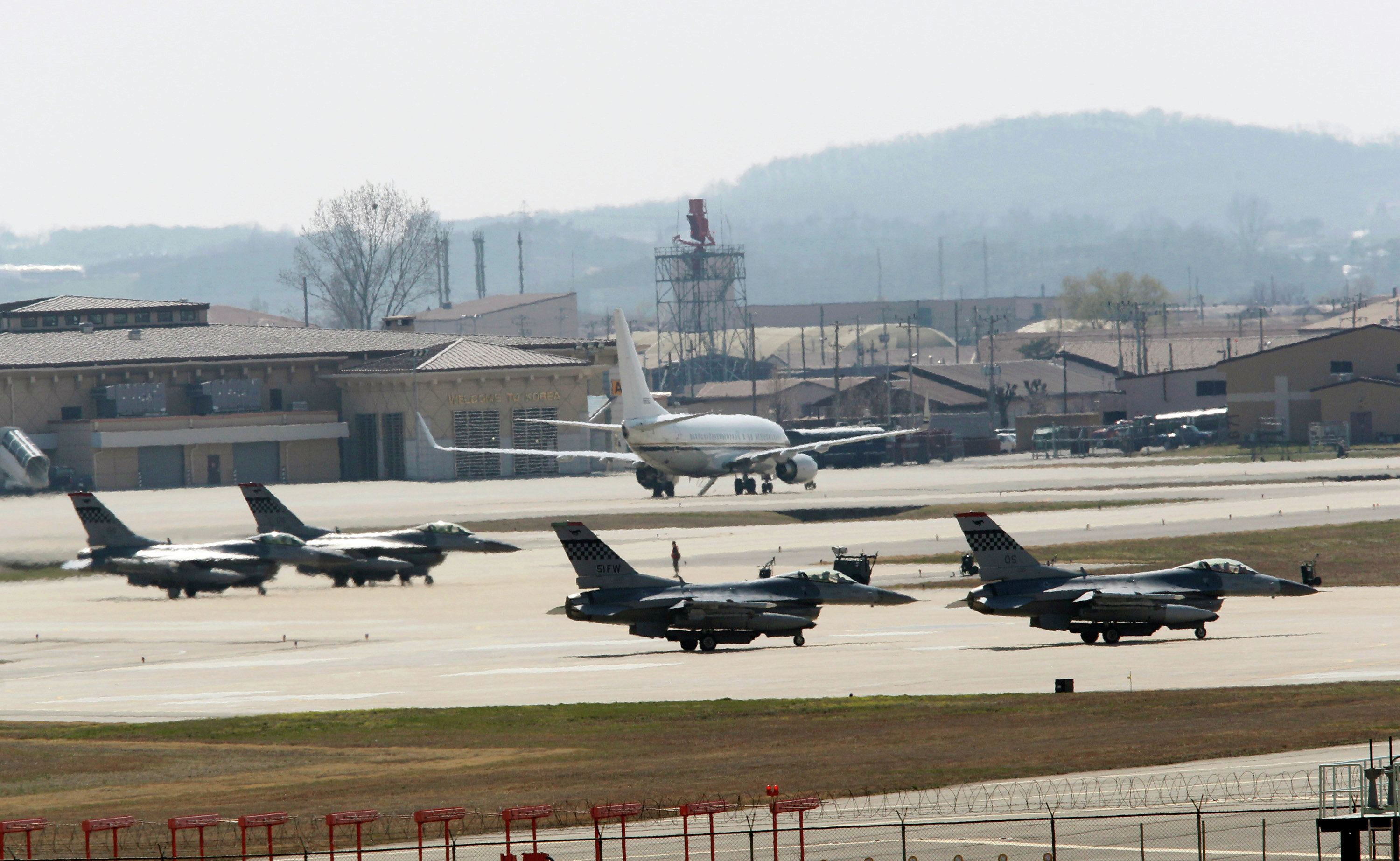 US Air Force F-16 fighter jets wait to take off from a runway during a military exercise at the Osan US Air Base in Osan, South Korea
