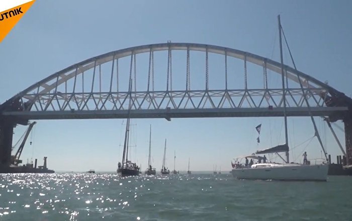 Over 20 Boats Sail Under the New Arch of Russia’s Bridge...