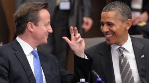 Prime Minister of the United Kingdom David Cameron L and President of the United States of America Barack Obama confer a