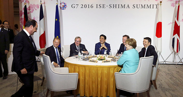 (L-R) French President Francois Hollande, European Council President Donald Tusk, European Commission President Jean-Claude Juncker, Japanese Prime Minister Shinzo Abe, Britain's Prime Minister David Cameron, German Chancellor Angela Merkel and Italian Prime Minister Matteo Renzi share a light moment as they gather for Japan EU EPA/FTA meeting at the summit of the leaders of the Group of Seven (G7) industrialized nations in Shima, central Japan, May 26, 2016