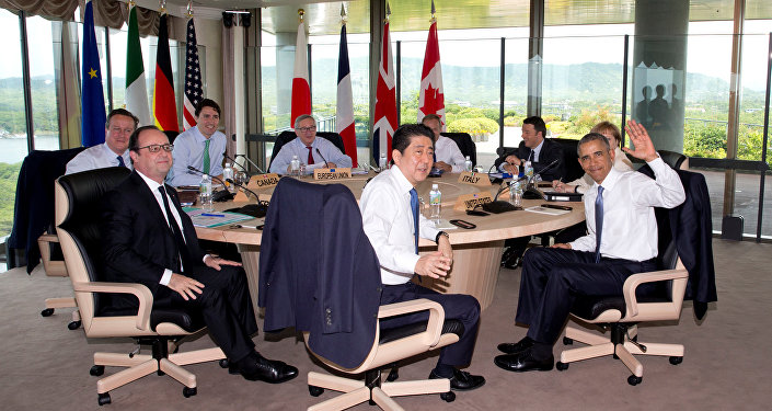 (Clockwise from left) British Prime Minister David Cameron, Canadian Prime Minister Justin Trudeau, European Commission President Jean-Claude Juncker, European Council President Donald Tusk, Italian Prime Minister Matteo Renzi, German Chancellor Angela Merkel, U.S. President Barack Obama, Japanese Prime Minister Shinzo Abe and French President Francois Hollande look to the media as they gather to participate in a G-7 Working Session in Shima, Japan, Friday, May 27, 2016, during the G-7 Summit