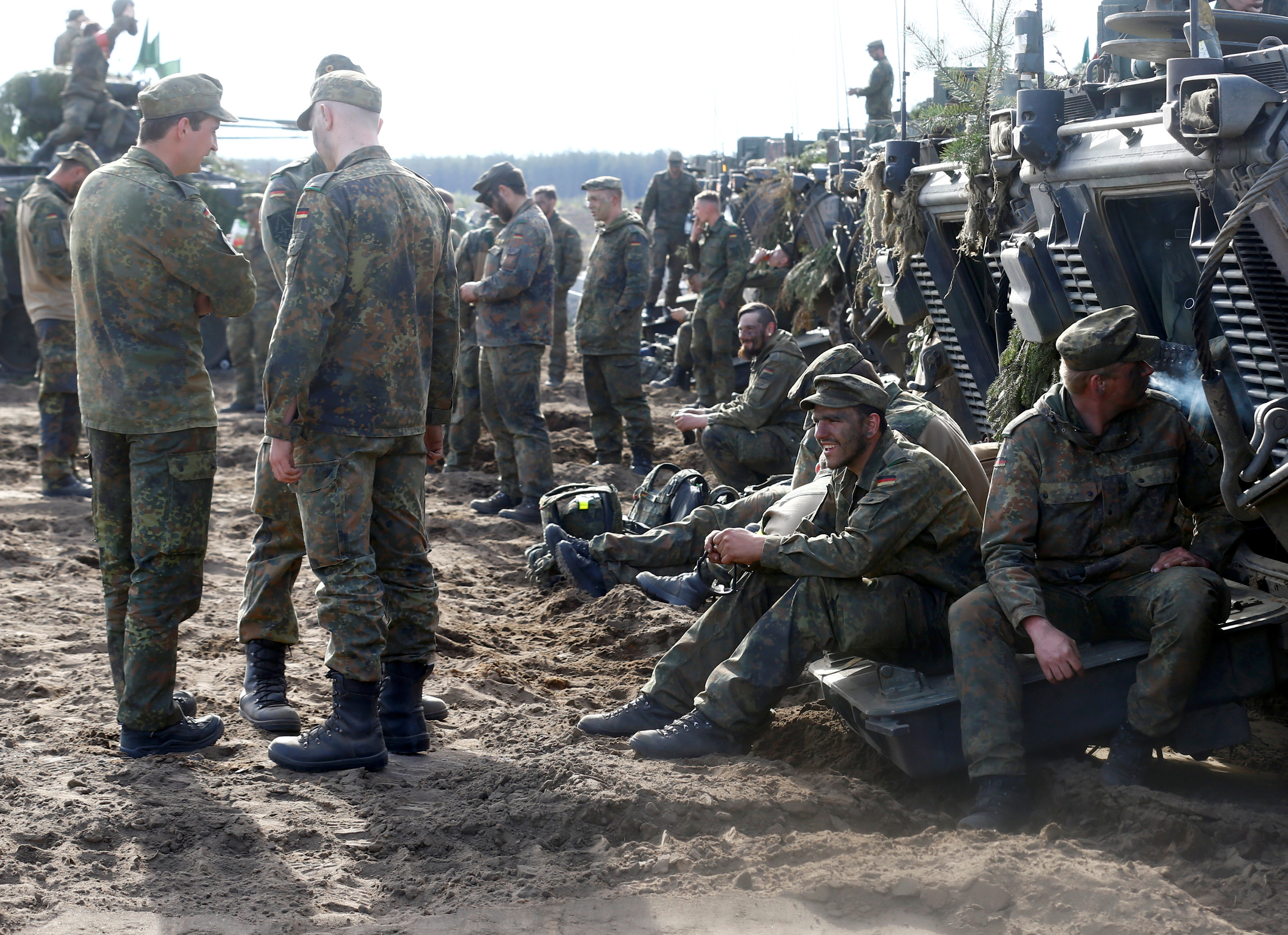 German army soldiers rest after NATO enchanced Forward Presence Battle Group Lithuania exercise in Pabrade military training field, Lithuania, May 17, 2017 German army soldiers rest after NATO enchanced Forward Presence Battle Group Lithuania exercise in Pabrade military training field, Lithuania, May 17, 2017