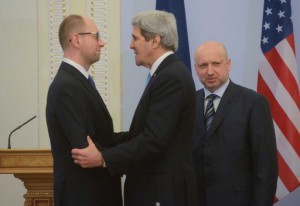 US Secretary of State John Kerry shaking hands of the members of the Ukrainian junta.